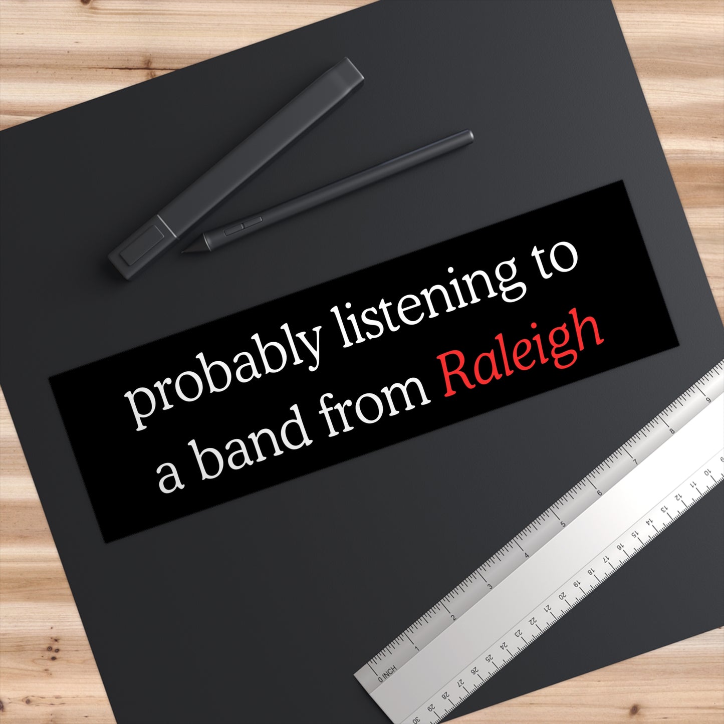 Probably listening to a band from Raleigh